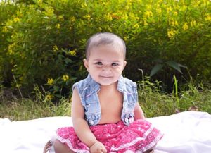 cute baby with denim vest 