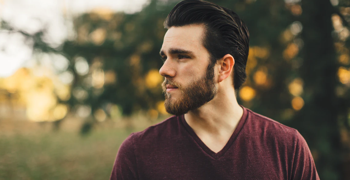 man wearing maroon V-neck t-shirt